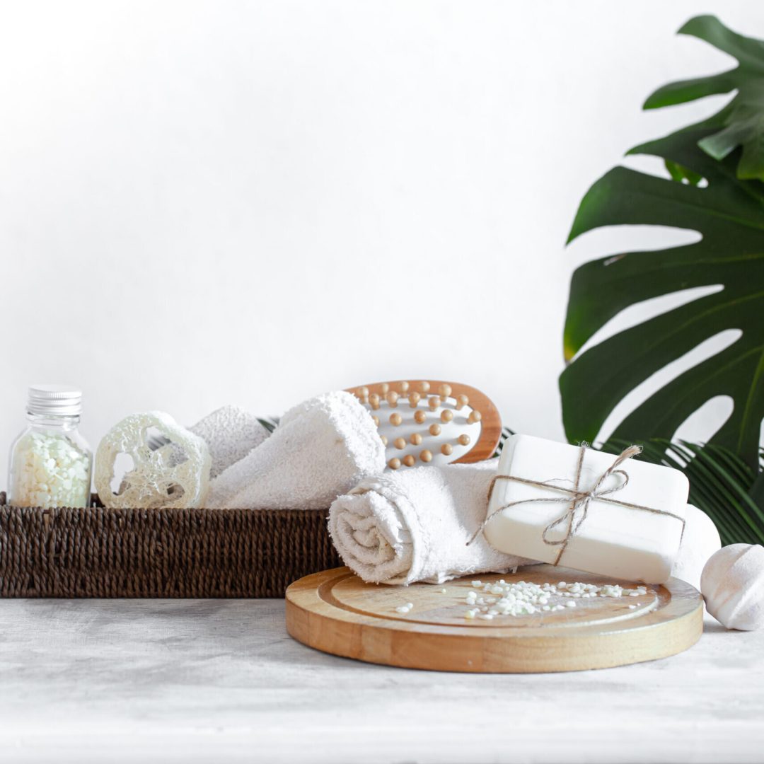 Spa composition with body care items on a light background . A place for text, a concept of beauty and body care .